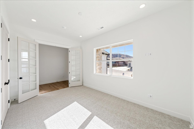1491 East Centaurus Way, Unit 86 Washington, UT 84780 - Photo 4 of 26 Unfurnished bedroom with french doors, carpet, and recessed lighting