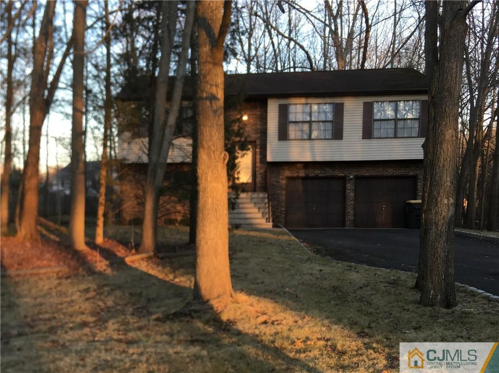 449 Cottrell Road Old Bridge, NJ 08857 - Photo 1 of 17 a front view of a house with trees