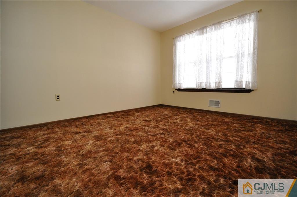 449 Cottrell Road Old Bridge, NJ 08857 - Photo 11 of 17 a view of an empty room with a window