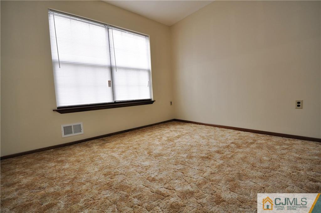 449 Cottrell Road Old Bridge, NJ 08857 - Photo 12 of 17 an empty room with a window