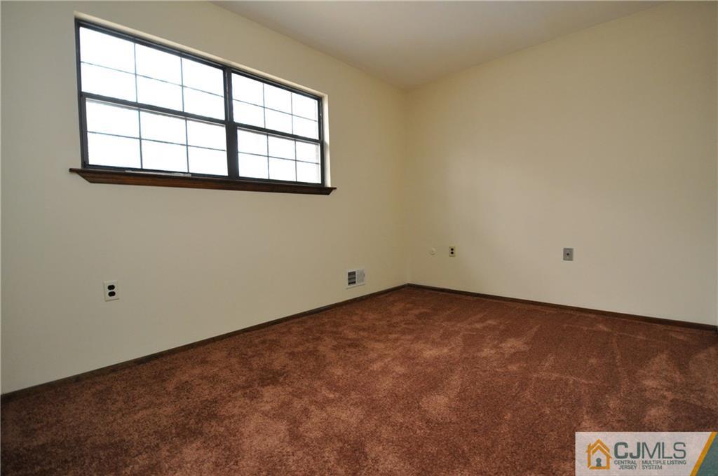 449 Cottrell Road Old Bridge, NJ 08857 - Photo 14 of 17 an empty room with a window