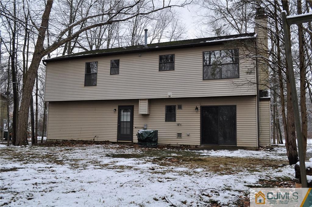 449 Cottrell Road Old Bridge, NJ 08857 - Photo 17 of 17 a front view of a house with a wooden fence