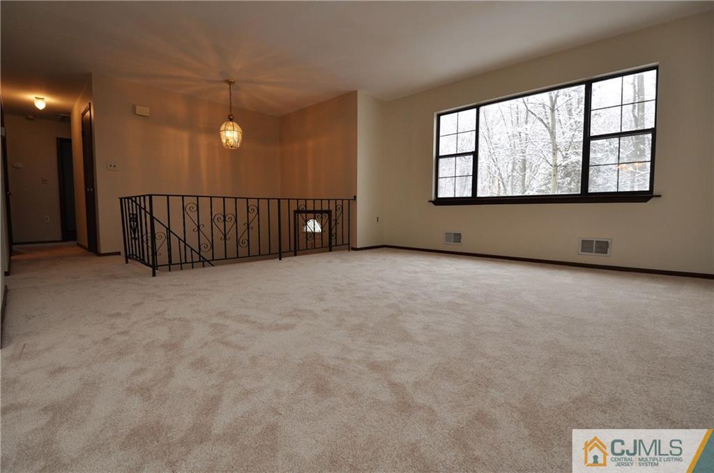 449 Cottrell Road Old Bridge, NJ 08857 - Photo 4 of 17 an empty room with windows