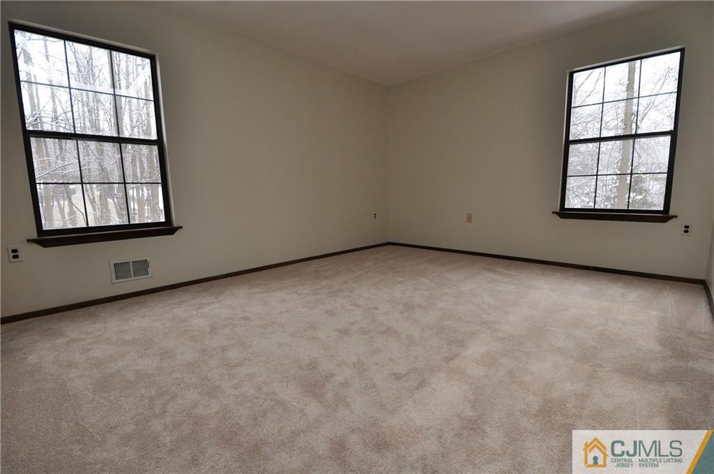 449 Cottrell Road Old Bridge, NJ 08857 - Photo 9 of 17 an empty room with windows
