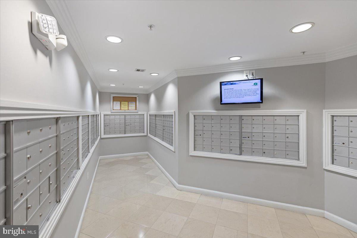 12001 Market Street, Unit 257 Reston, VA 20190 - Photo 23 of 33 a view of a hallway with windows