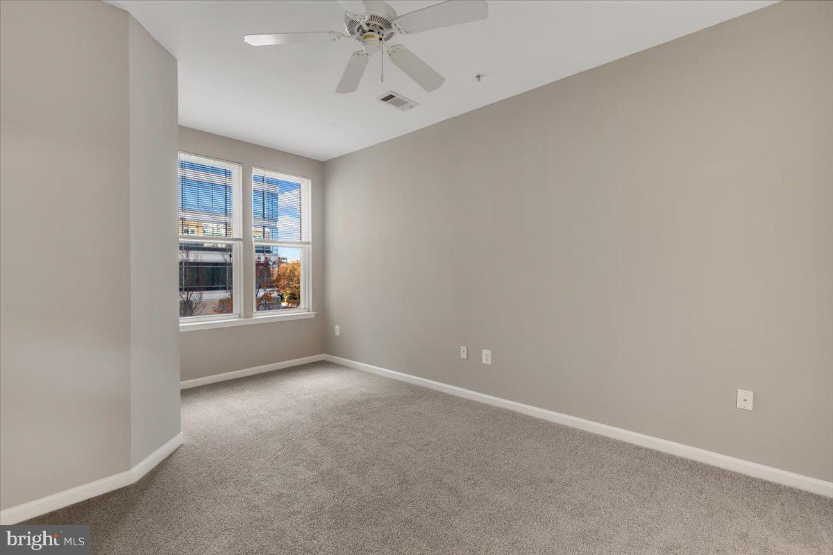 12001 Market Street, Unit 257 Reston, VA 20190 - Photo 9 of 33 a view of an empty room with a window
