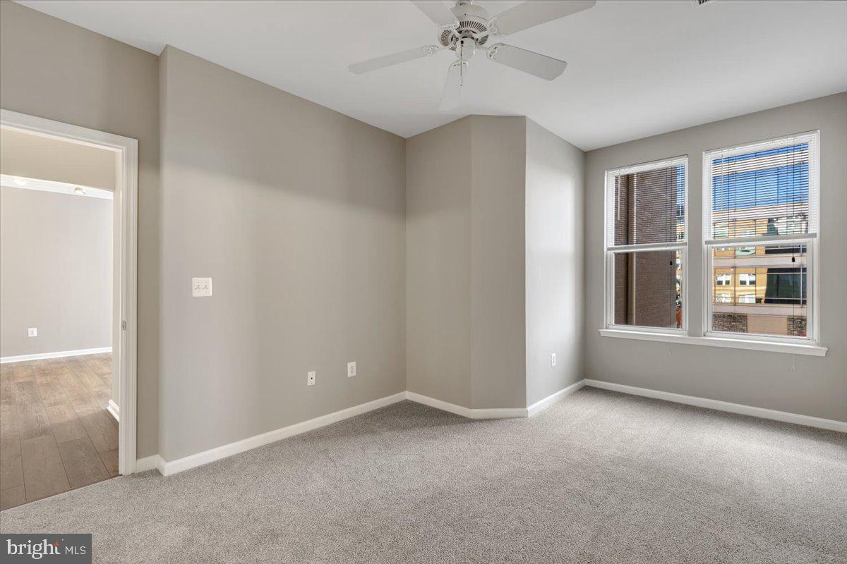 12001 Market Street, Unit 257 Reston, VA 20190 - Photo 10 of 33 a view of an empty room with a window