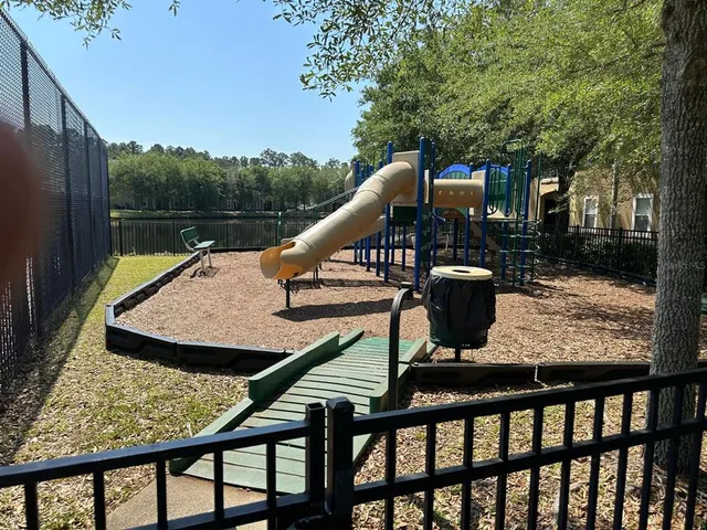 a view of deck with furniture and trees