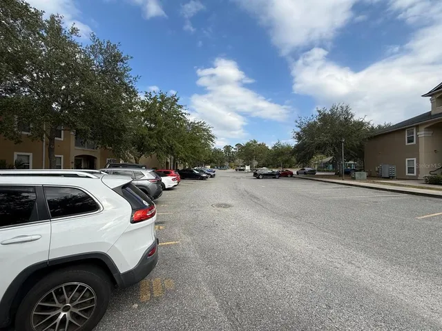 a view of street with parked cars