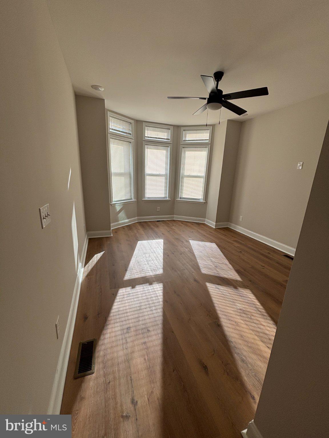 4818 Pimlico Road Baltimore, MD 21215 - Photo 16 of 18 a view of an empty room and window