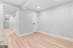 4818 Pimlico Road Baltimore, MD 21215 - Photo 4 of 18 wooden floor in an empty room