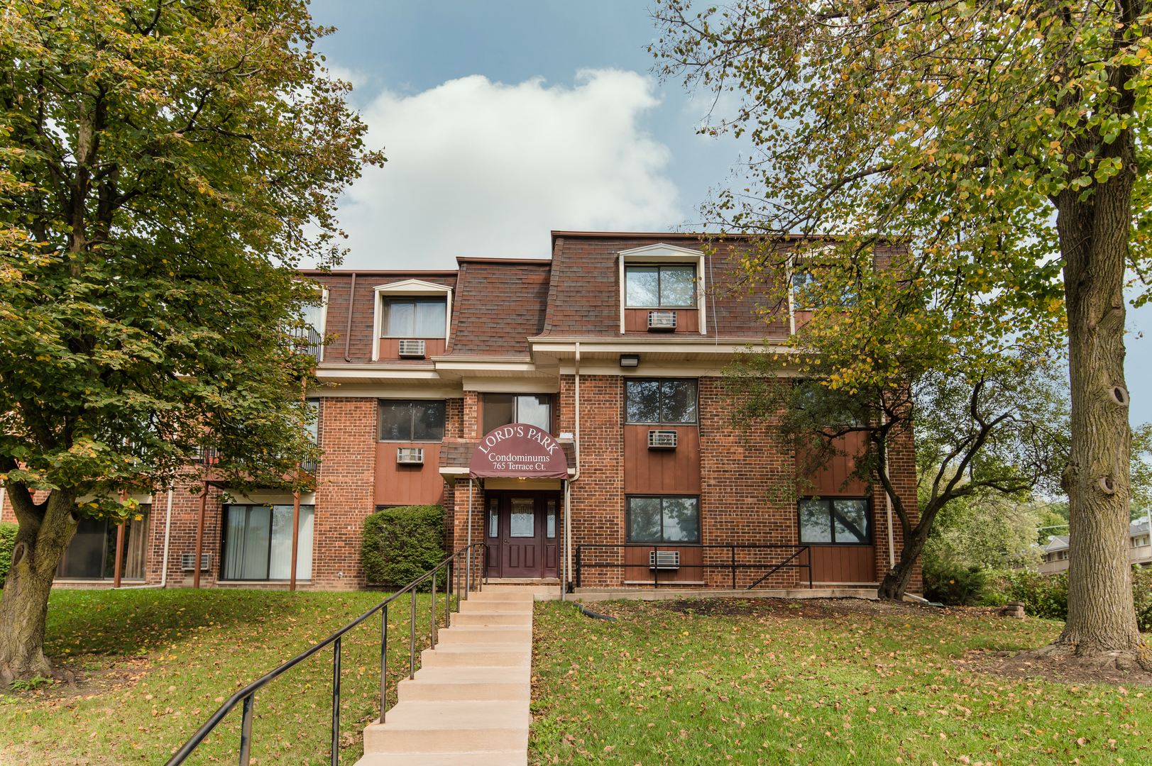 765 Terrace Court, Unit 206 Elgin, IL 60120 - Photo 1 of 31 a front view of a house with a yard