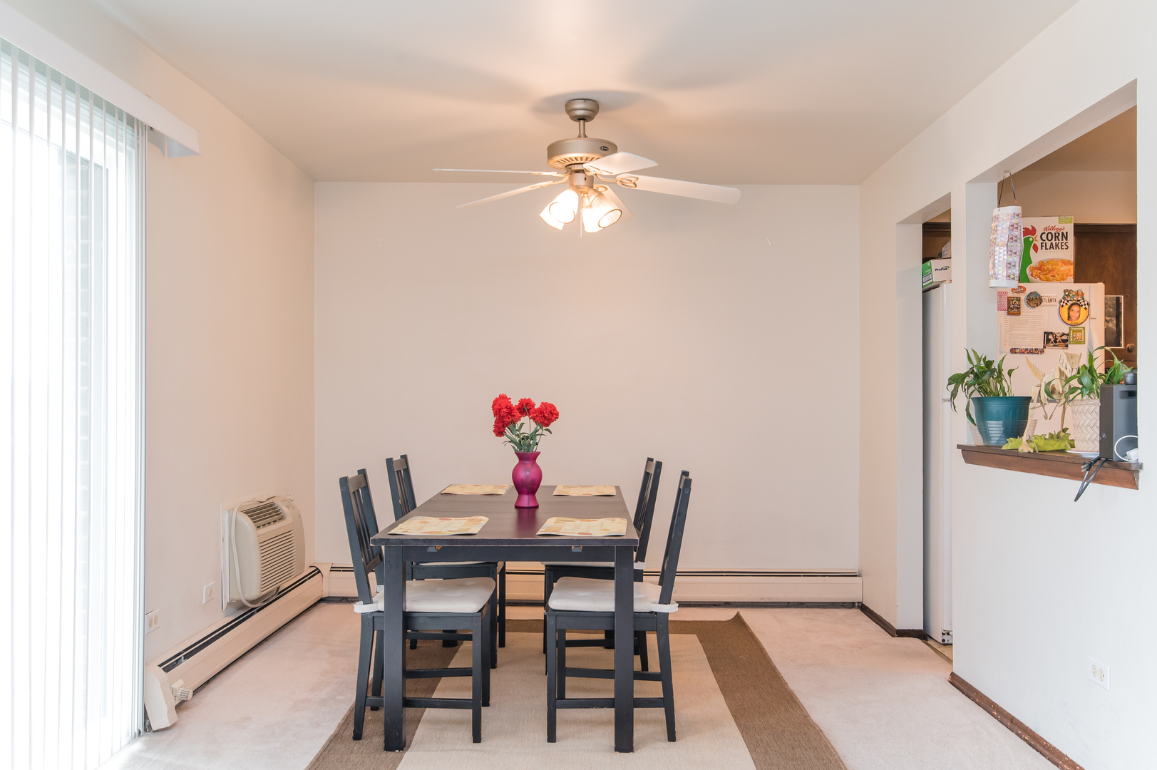 765 Terrace Court, Unit 206 Elgin, IL 60120 - Photo 13 of 31 a view of a dining room with furniture and chandelier