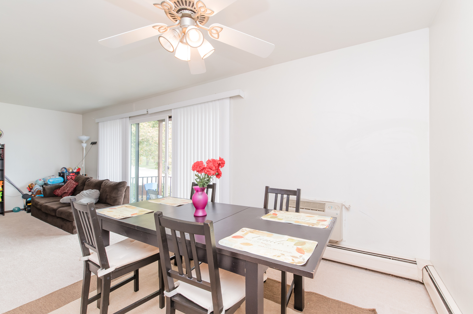 765 Terrace Court, Unit 206 Elgin, IL 60120 - Photo 15 of 31 a view of a dining room with furniture and a chandelier