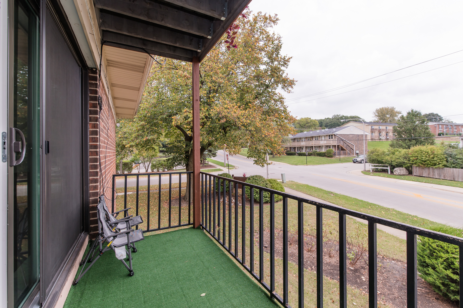 765 Terrace Court, Unit 206 Elgin, IL 60120 - Photo 20 of 31 a view of a porch with a yard