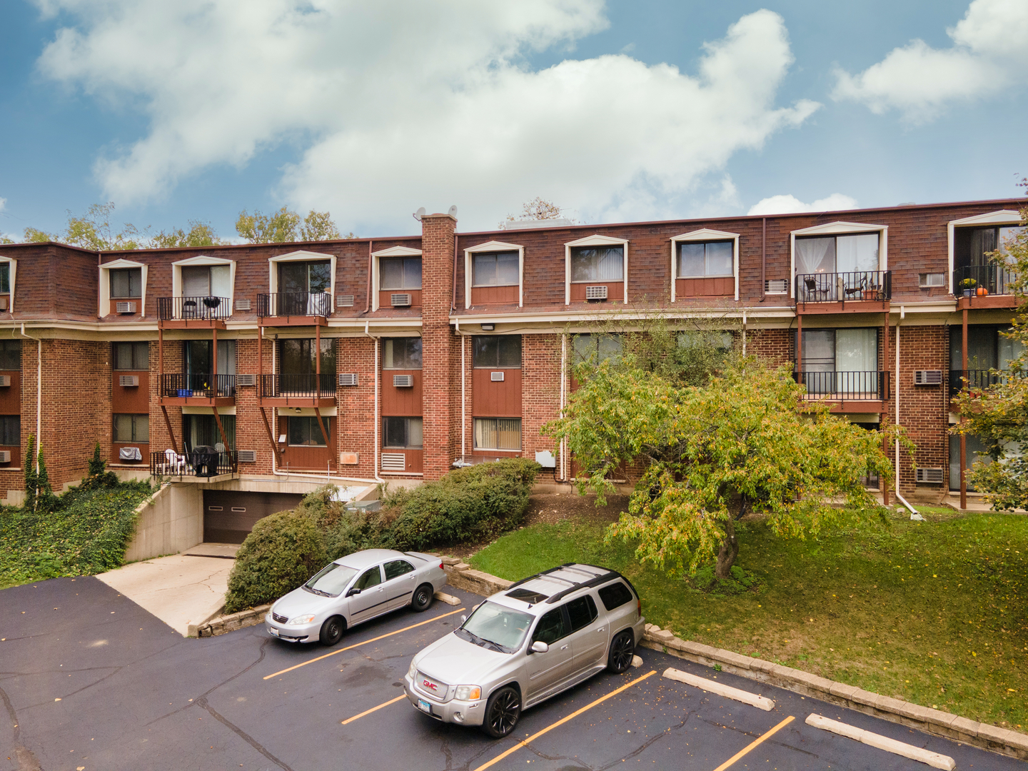 765 Terrace Court, Unit 206 Elgin, IL 60120 - Photo 23 of 31 a car parked in front of a building