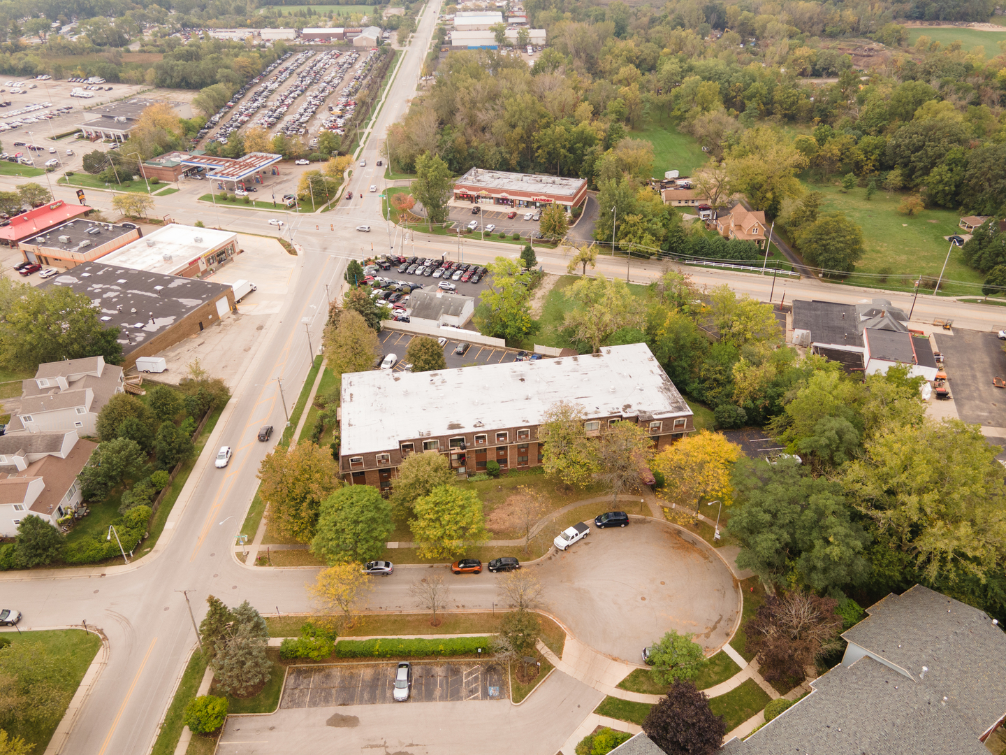 765 Terrace Court, Unit 206 Elgin, IL 60120 - Photo 30 of 31 an aerial view of a house with a yard and lake view