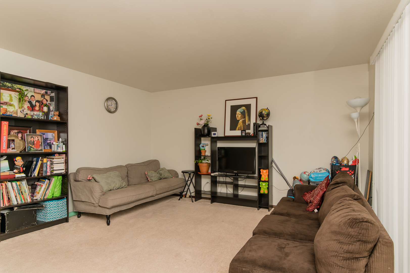 765 Terrace Court, Unit 206 Elgin, IL 60120 - Photo 9 of 31 a living room with furniture workspace and a couch