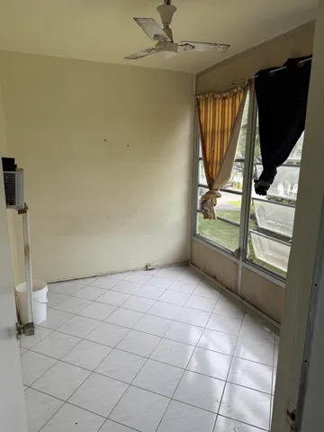 a view of an empty room and window