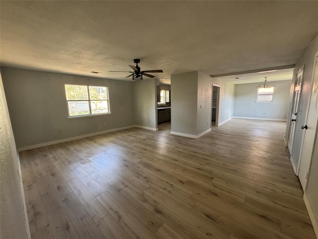 402 North Hughes Street Howe, TX 75459 - Photo 13 of 17 Unfurnished room featuring light wood-style flooring and ceiling fan