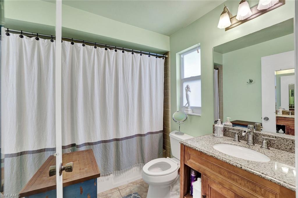 208 Baltusrol Drive Naples, FL 34113 - Photo 17 of 25 3rd bathroom with tub