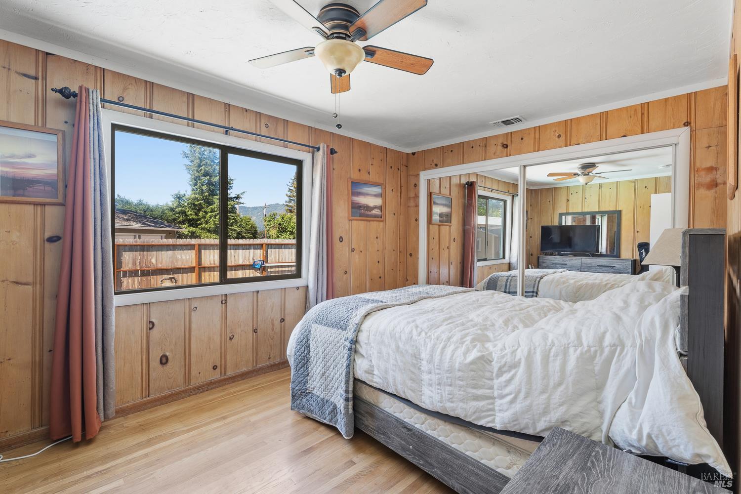 2260 Old River Road Ukiah, CA 95482 - Photo 18 of 29 a bedroom with a large bed and a large window
