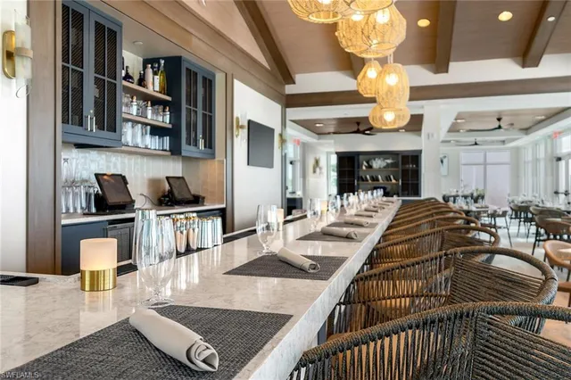 a lots of tables and chairs in a large kitchen