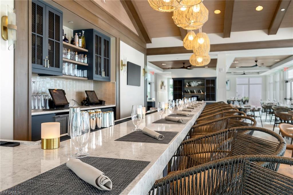 5100 Baybridge Boulevard, Unit 1501 Estero, FL 33928 - Photo 19 of 39 a view of a dining room and hall with furniture
