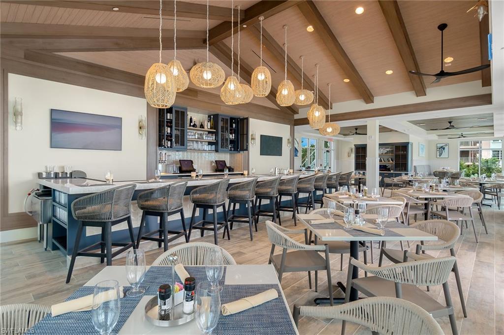 5100 Baybridge Boulevard, Unit 1501 Estero, FL 33928 - Photo 23 of 39 a group of people sitting at tables in a living room