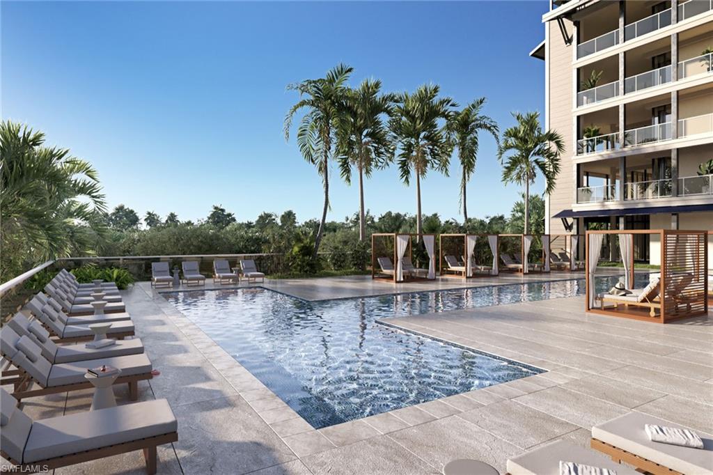 5100 Baybridge Boulevard, Unit 1501 Estero, FL 33928 - Photo 9 of 39 a view of a swimming pool with a lounge chair