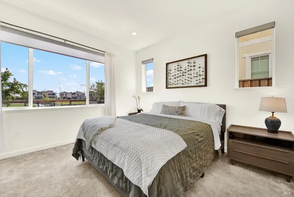 a bedroom with a bed and window