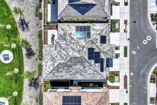 an aerial view of residential houses with outdoor space