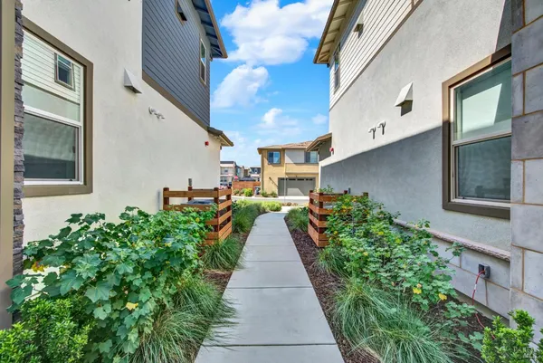 a view of a pathway with building in the background