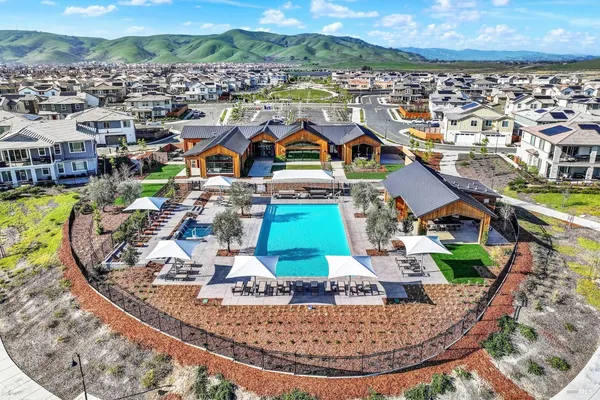 a view of a swimming pool and outdoor seating