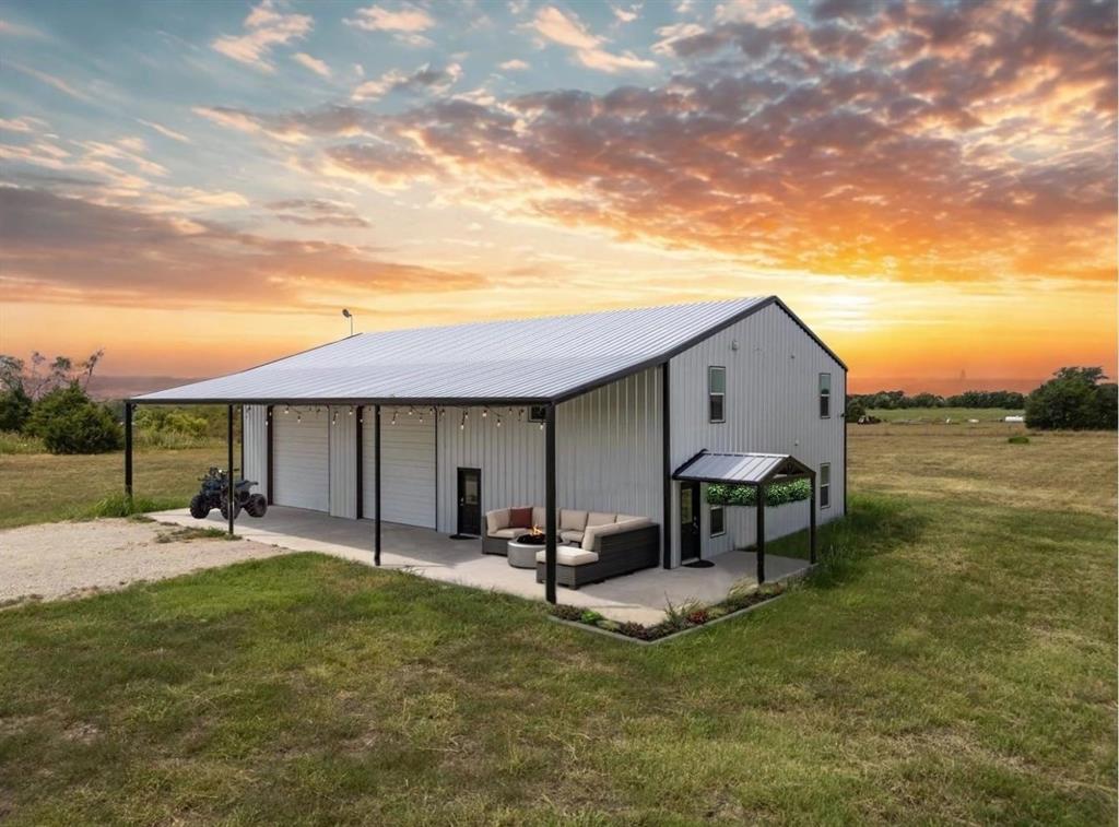 2922 Private Road 5786 Blue Ridge, TX 75424 - Photo 1 of 1 a backyard of a house with table and chairs