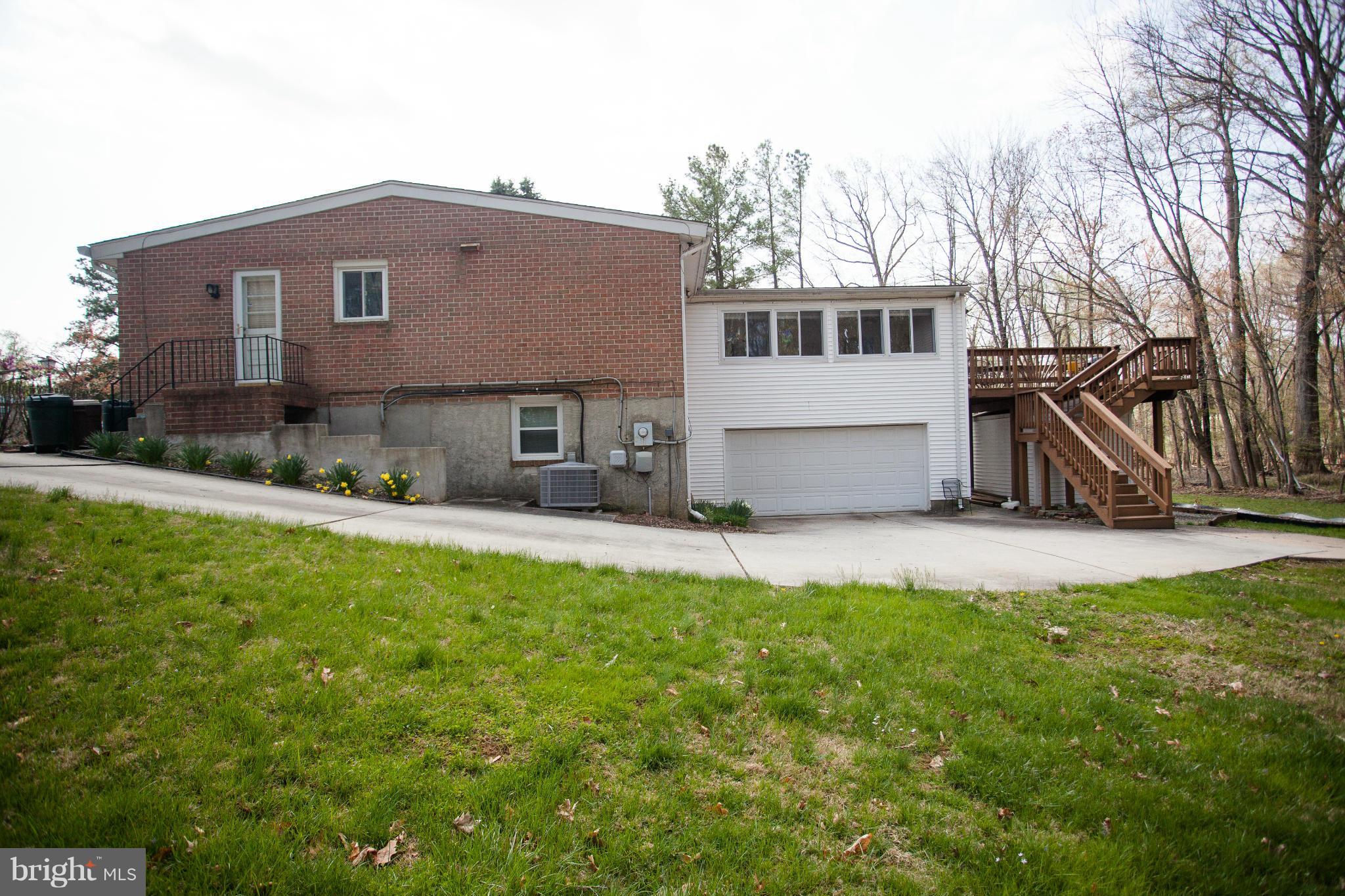 9407 Jodale Road Randallstown, MD 21133 - Photo 21 of 26 a house view with a sitting space and garden