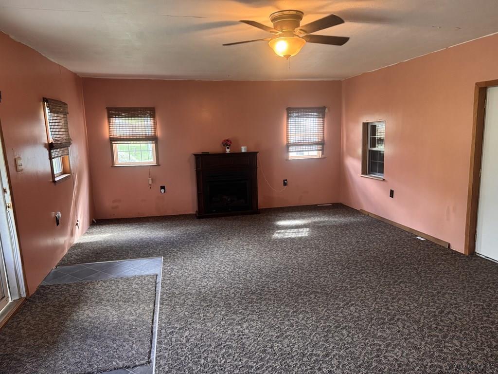 127 1st Street Twin Rocks, PA 15960 - Photo 13 of 20 a view of a livingroom with a ceiling fan and window