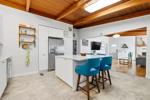 a view of a livingroom with furniture and a flat screen tv