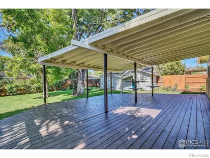a view of outdoor space with wooden floor