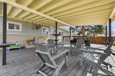 a view of a patio with a table and chairs