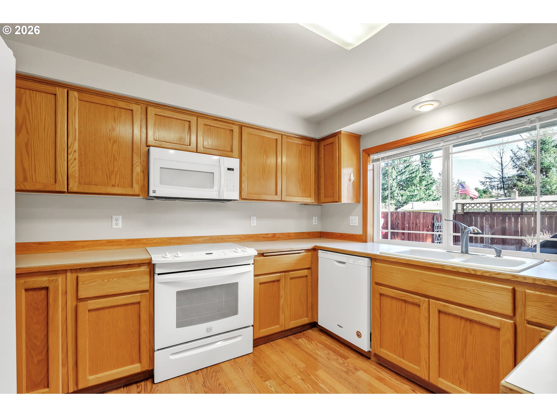 4471 Spring Meadow Avenue Eugene, OR 97404 - Photo 11 of 31 a kitchen with a sink stove and cabinets
