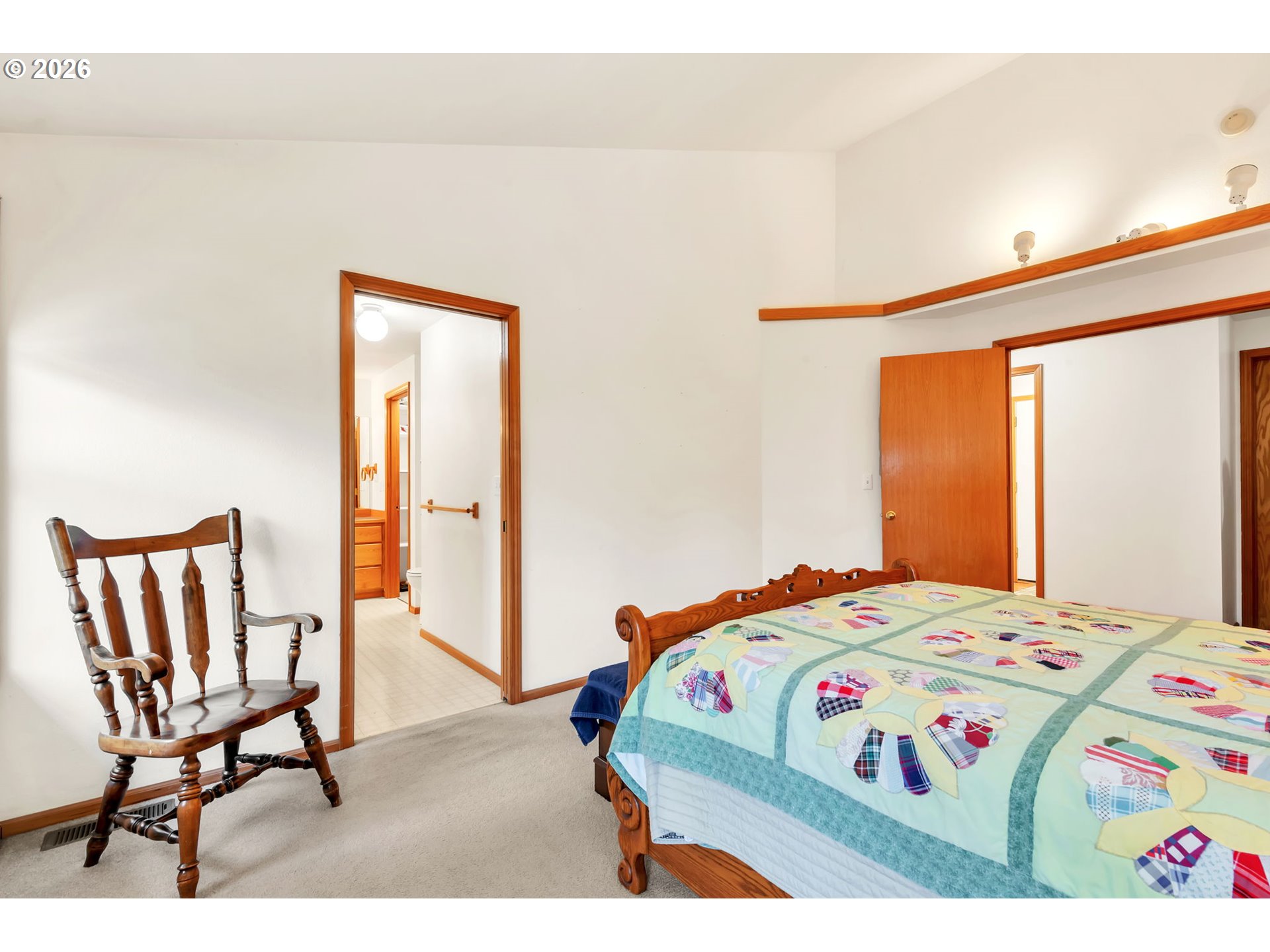 4471 Spring Meadow Avenue Eugene, OR 97404 - Photo 16 of 31 a bedroom with a bed and a table