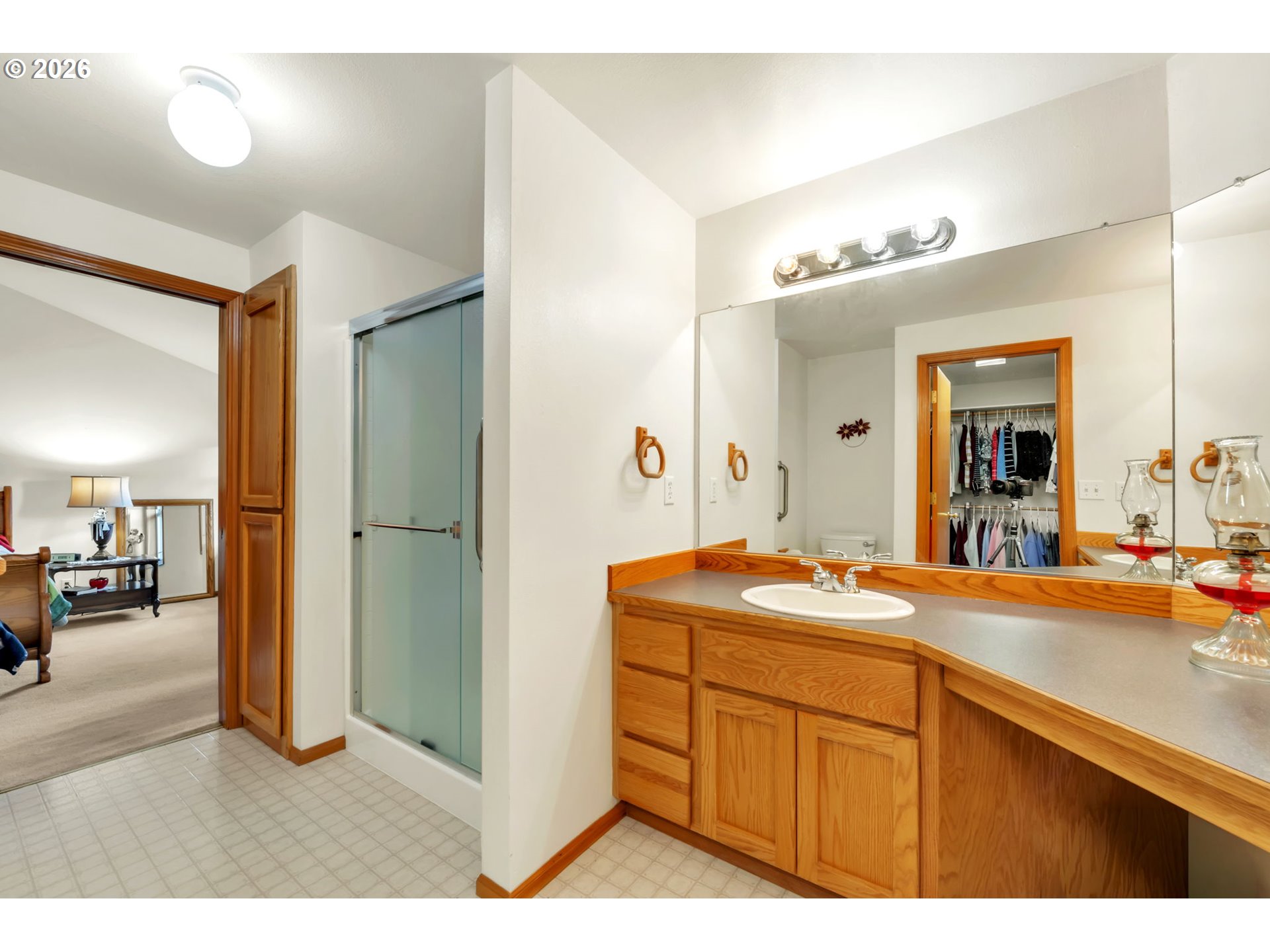 4471 Spring Meadow Avenue Eugene, OR 97404 - Photo 20 of 31 a en suite bathroom with a granite countertop sink and mirror