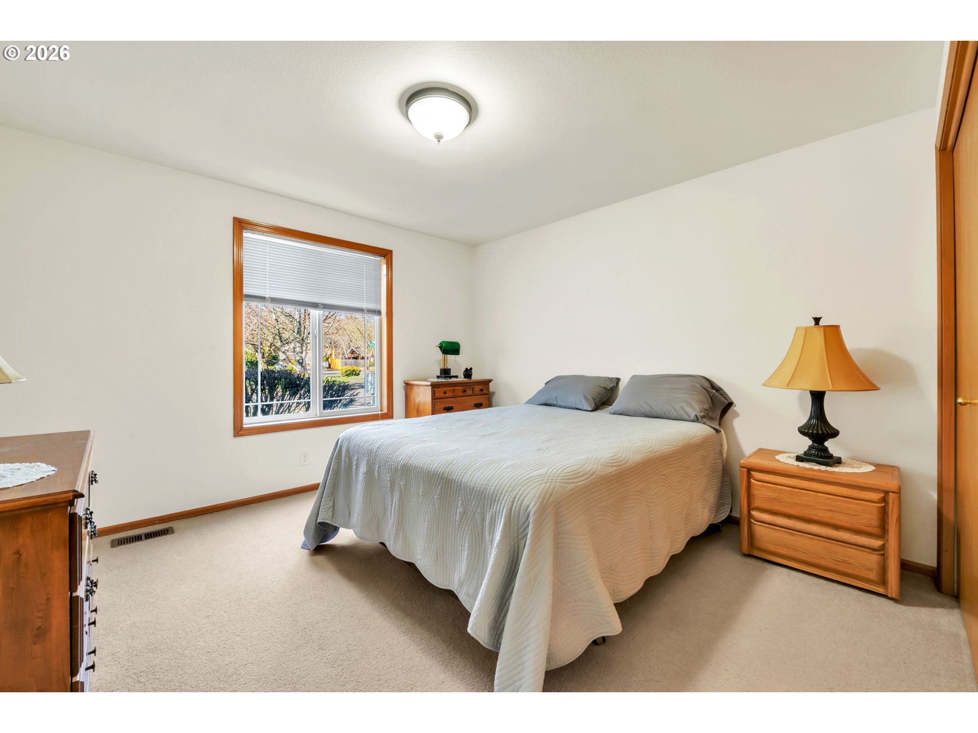 4471 Spring Meadow Avenue Eugene, OR 97404 - Photo 21 of 31 a bedroom with a bed and a window