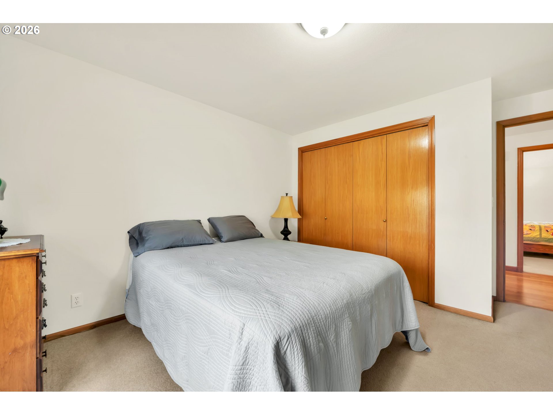 4471 Spring Meadow Avenue Eugene, OR 97404 - Photo 22 of 31 a bedroom with a bed and wooden floor