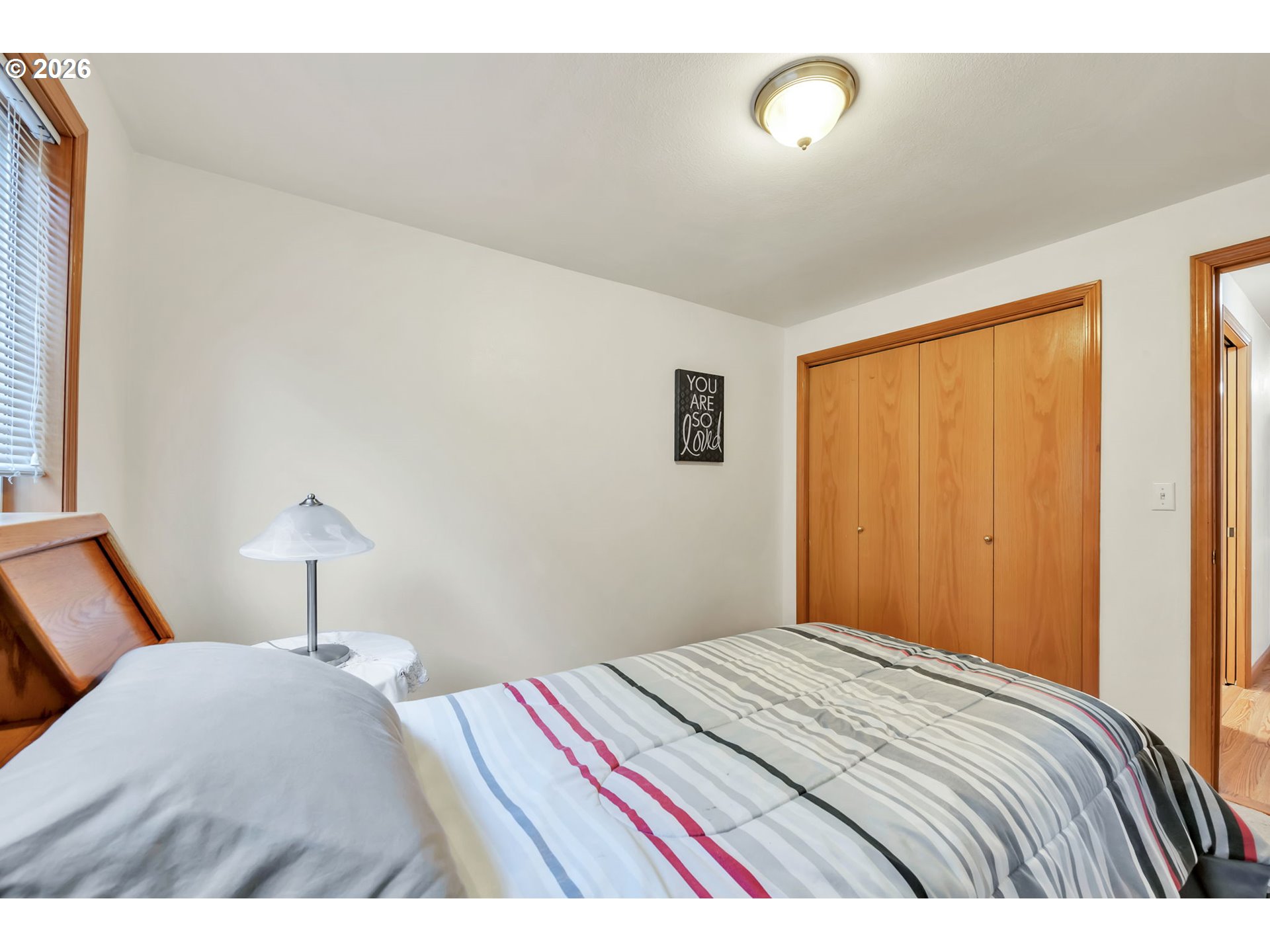 4471 Spring Meadow Avenue Eugene, OR 97404 - Photo 25 of 31 a bedroom with a bed and a window