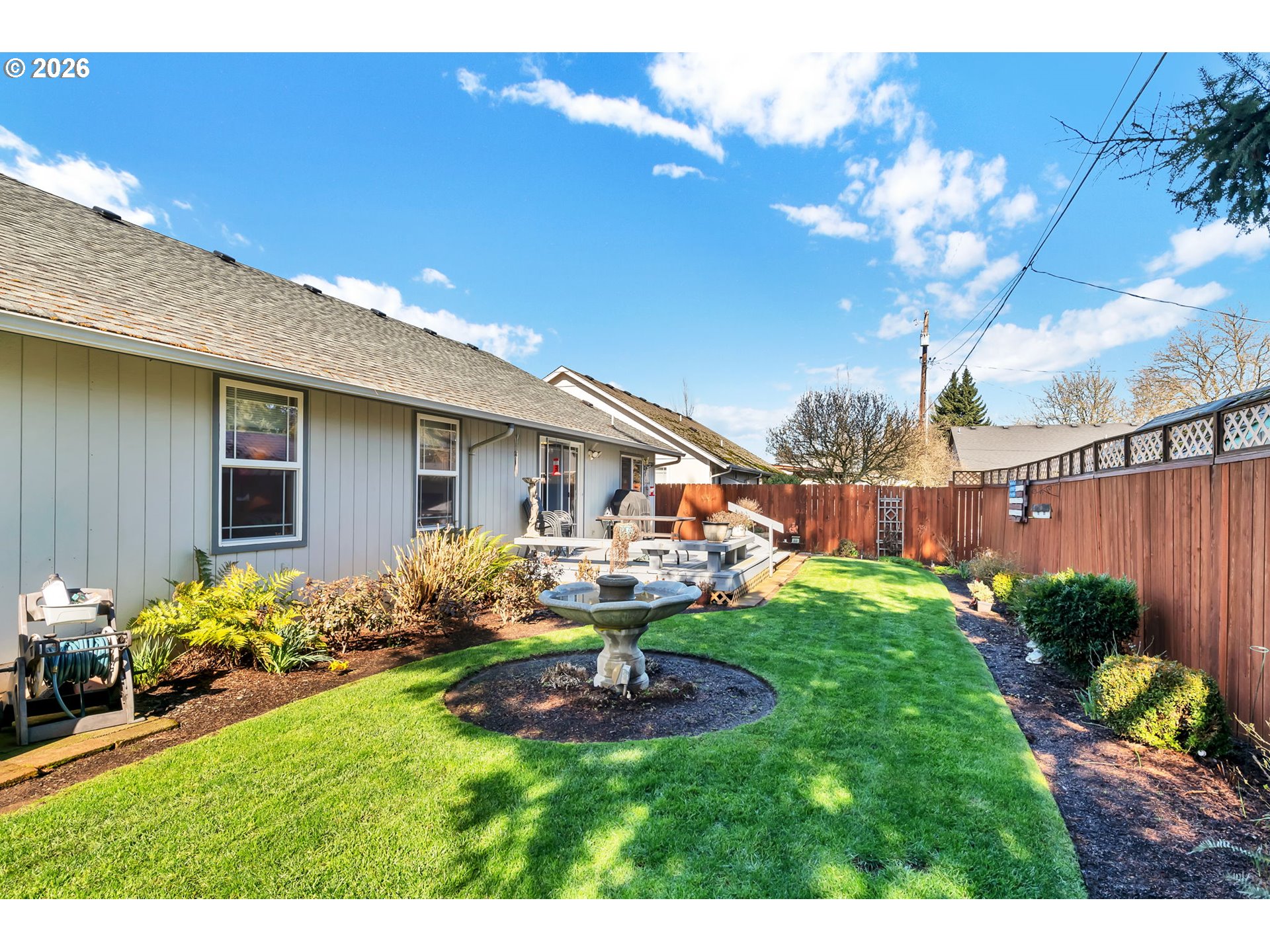 4471 Spring Meadow Avenue Eugene, OR 97404 - Photo 30 of 31 a view of a house with backyard sitting area and garden