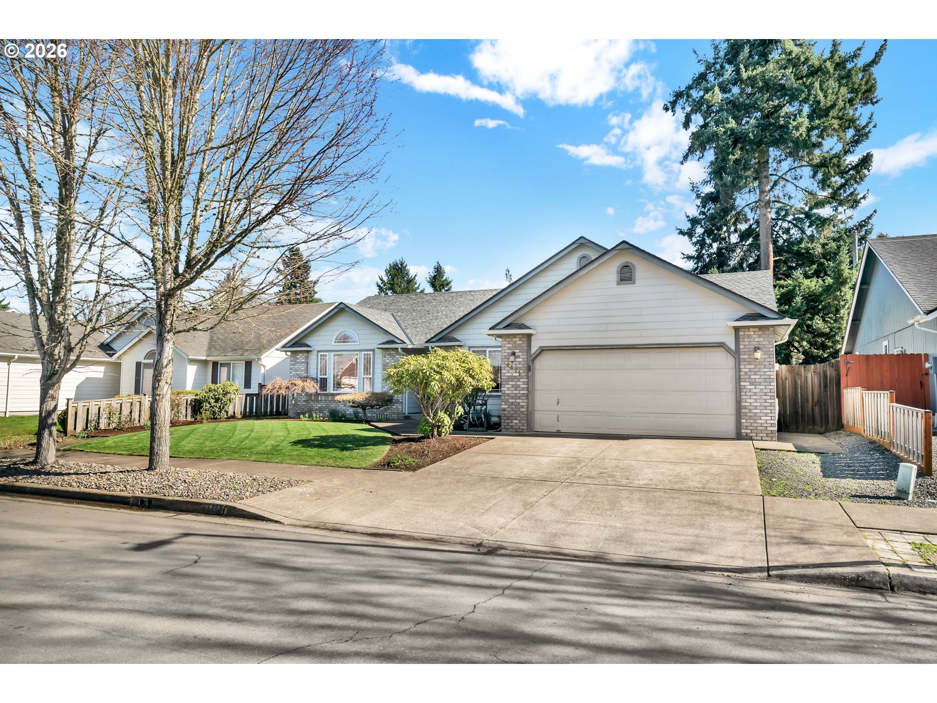 4471 Spring Meadow Avenue Eugene, OR 97404 - Photo 31 of 31 a front view of a house with a yard and garage