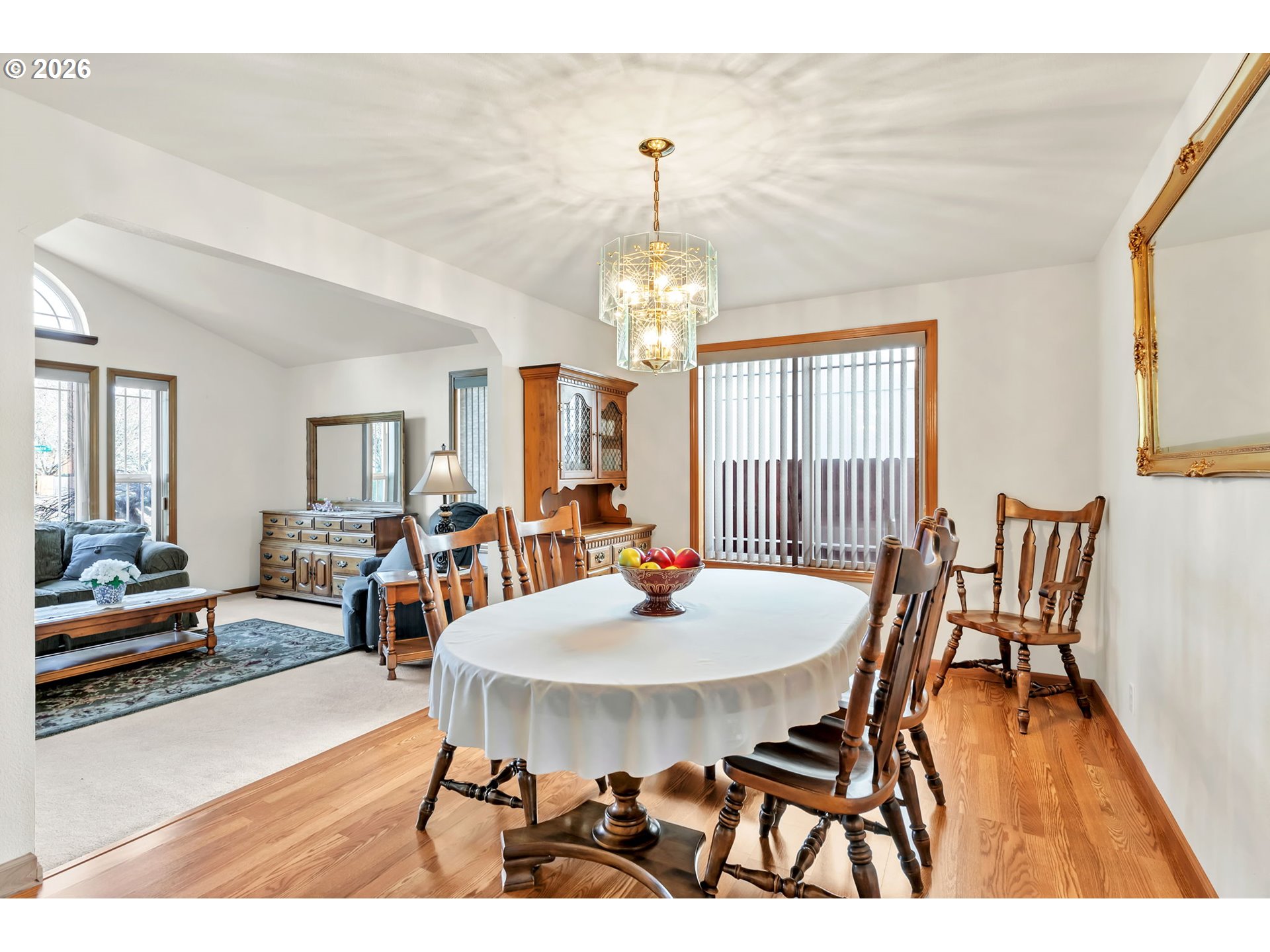 4471 Spring Meadow Avenue Eugene, OR 97404 - Photo 4 of 31 a dining room with furniture a chandelier and wooden floor