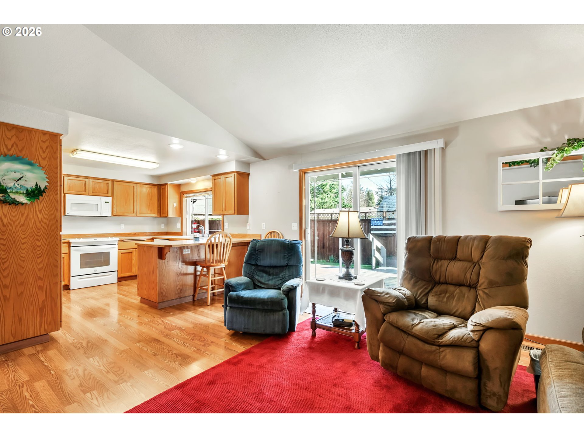 4471 Spring Meadow Avenue Eugene, OR 97404 - Photo 8 of 31 a living room with furniture kitchen view and a large window
